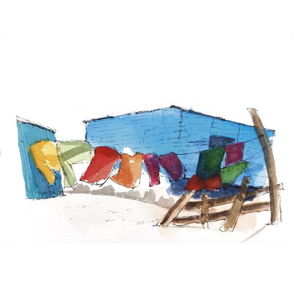 Casita azul con ropa tendida en Sudáfrica